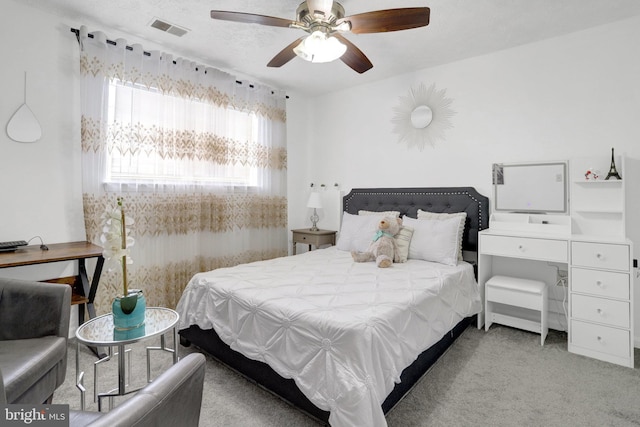 bedroom with ceiling fan, carpet flooring, and visible vents