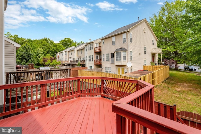 wooden terrace with a residential view