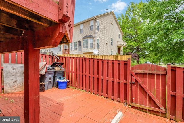 view of patio / terrace with a gate and fence