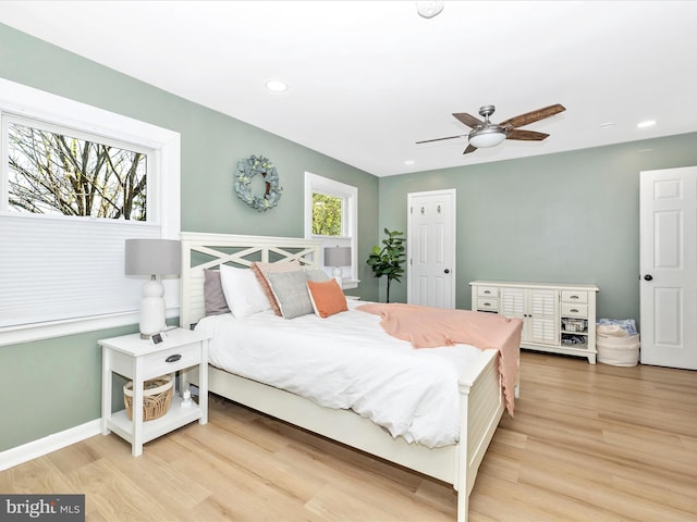 bedroom featuring baseboards, a ceiling fan, recessed lighting, and wood finished floors