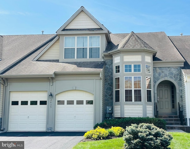 2435 Mill Race Rd, Frederick, MD 21701 - view of front facade featuring entry steps, a shingled roof, stone siding, and driveway