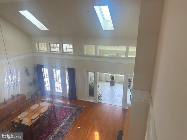 2435 Mill Race Rd, Frederick, MD 21701 - living room with french doors, high vaulted ceiling, a skylight, and wood finished floors