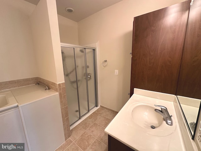 2435 Mill Race Rd, Frederick, MD 21701 - bathroom featuring vanity, a garden tub, a shower stall, and tile patterned floors