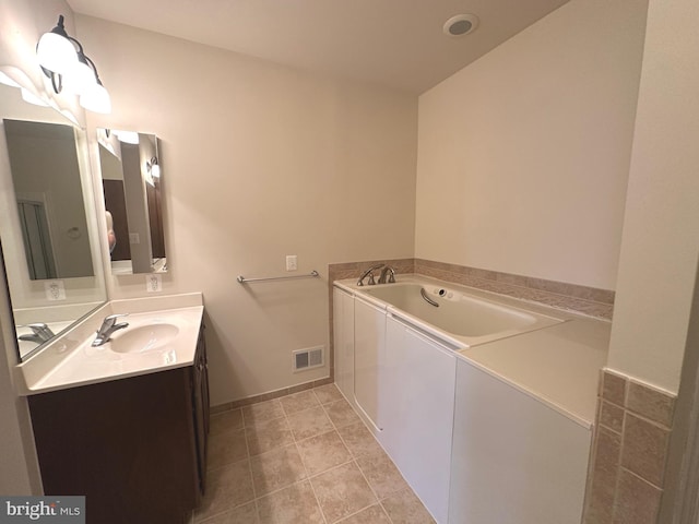 2435 Mill Race Rd, Frederick, MD 21701 - full bathroom featuring baseboards, visible vents, tile patterned flooring, a garden tub, and vanity