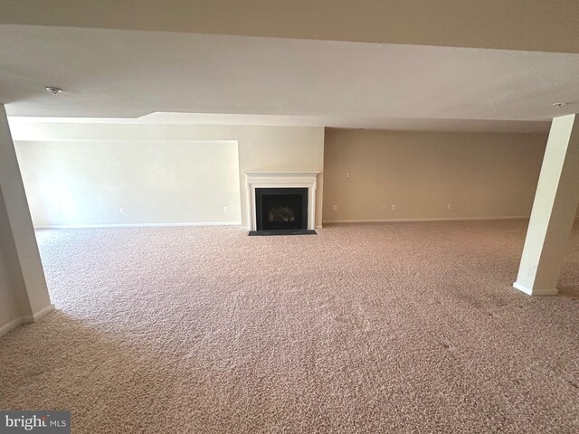 2435 Mill Race Rd, Frederick, MD 21701 - unfurnished living room featuring baseboards, a fireplace with flush hearth, and carpet floors
