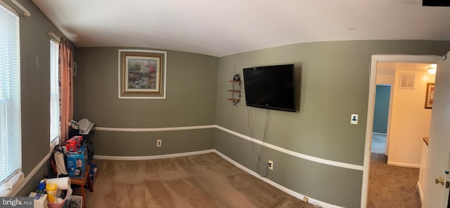 recreation room featuring carpet floors, lofted ceiling, and baseboards
