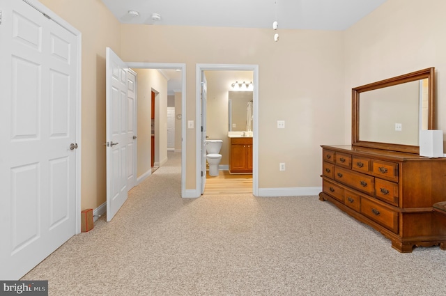 1818 Selvin Dr Unit 204, Bel Air, MD 21015 - bedroom with light colored carpet, ensuite bathroom, and baseboards
