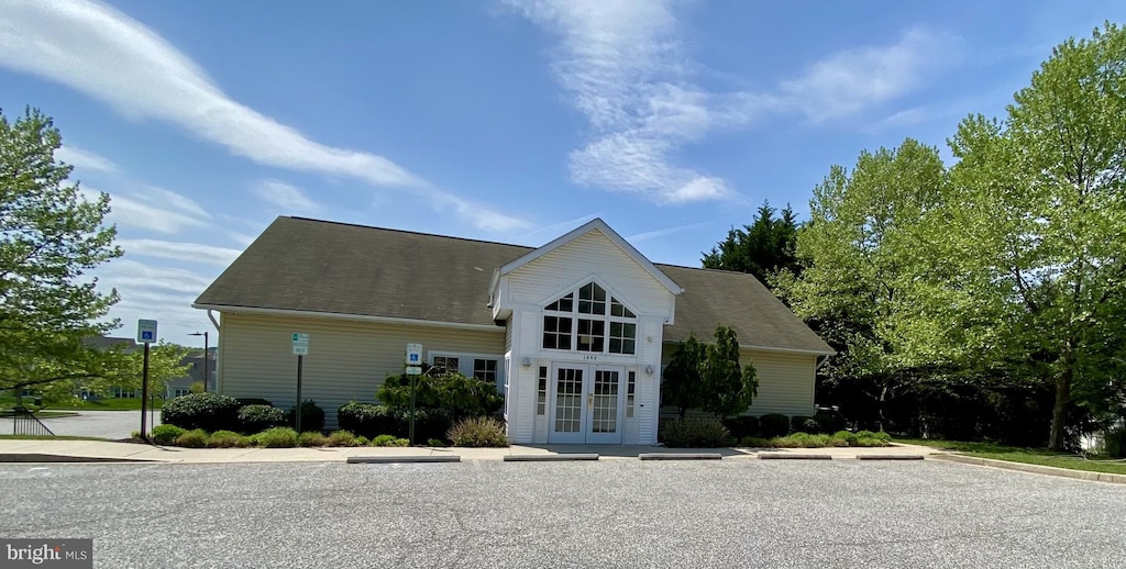 view of property featuring uncovered parking