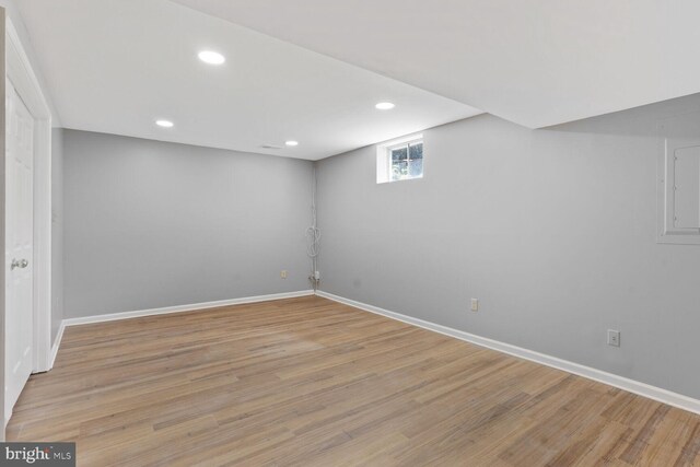 below grade area with baseboards, recessed lighting, and wood finished floors