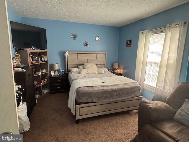 carpeted bedroom with a textured ceiling