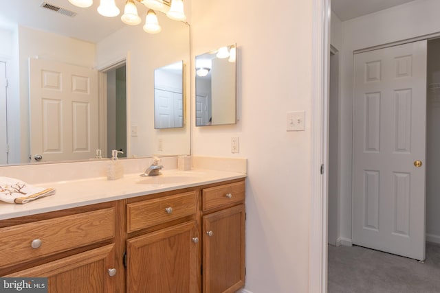 bathroom featuring vanity and visible vents