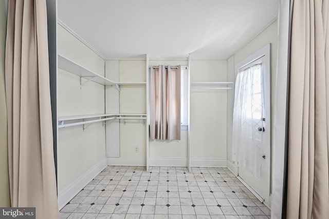 spacious closet featuring light floors