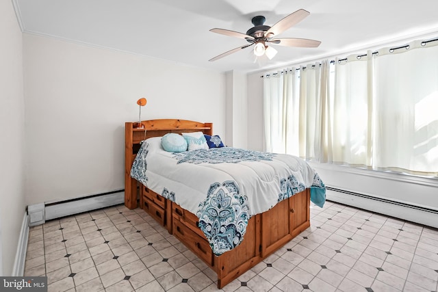 bedroom with ceiling fan, ornamental molding, and a baseboard heating unit
