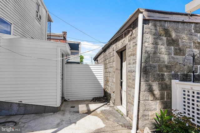 view of property exterior featuring fence