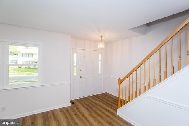 4038 Diane Way, Doylestown, PA 18902 - foyer entrance featuring baseboards, stairs, wood finished floors, and a notable chandelier
