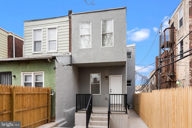 5210 Arch St, Philadelphia, PA 19139 - view of front of house with fence and stucco siding