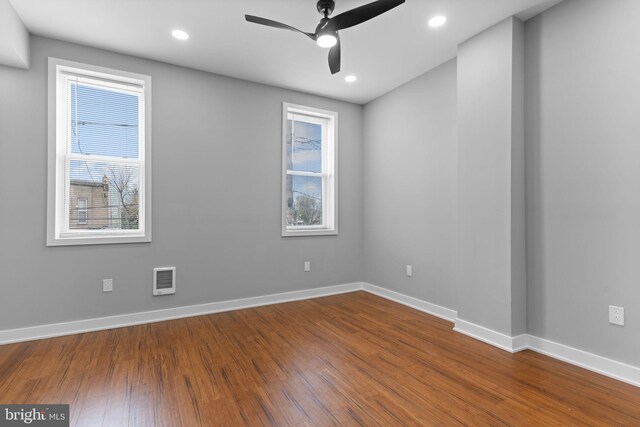 5210 Arch St, Philadelphia, PA 19139 - unfurnished room featuring baseboards, visible vents, wood finished floors, and ceiling fan