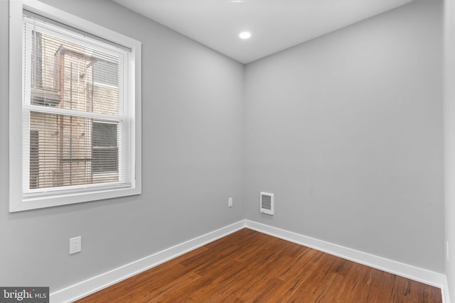 5210 Arch St, Philadelphia, PA 19139 - unfurnished room featuring dark wood-type flooring, recessed lighting, visible vents, and baseboards