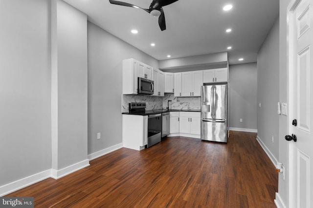 5210 Arch St, Philadelphia, PA 19139 - kitchen featuring recessed lighting, dark wood-type flooring, a ceiling fan, dark countertops, and appliances with stainless steel finishes