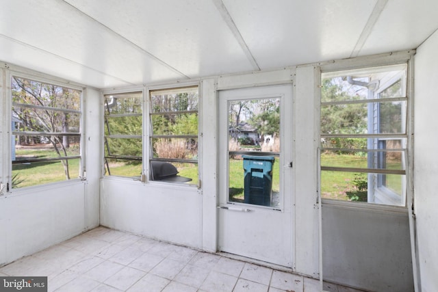unfurnished sunroom with a healthy amount of sunlight