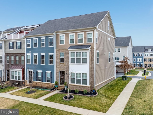 1579 Meadowlark Glen Rd, Dumfries, VA 22026 - view of property featuring a residential view, a front lawn, and brick siding