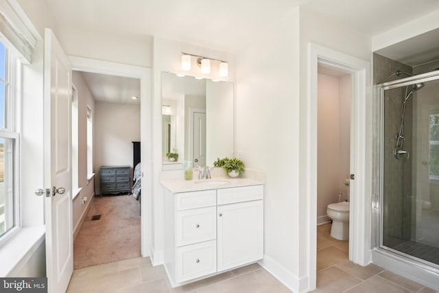 1579 Meadowlark Glen Rd, Dumfries, VA 22026 - ensuite bathroom with tile patterned flooring, vanity, toilet, connected bathroom, and a stall shower