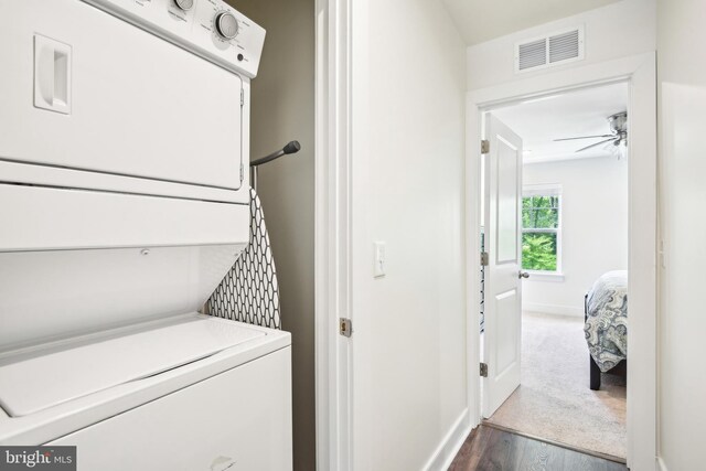 1579 Meadowlark Glen Rd, Dumfries, VA 22026 - laundry area with visible vents, stacked washer and clothes dryer, baseboards, ceiling fan, and dark wood finished floors