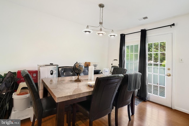 24 Amarillo Ct Unit 125, Germantown, MD 20874 - dining room with wood finished floors, a chandelier, and baseboards