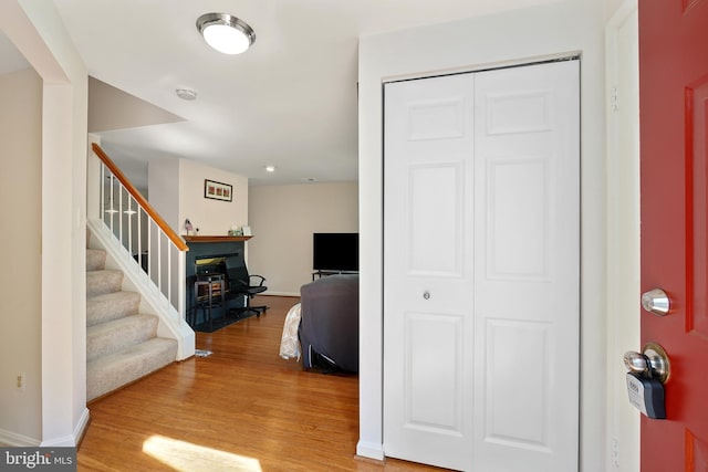 24 Amarillo Ct Unit 125, Germantown, MD 20874 - foyer with wood finished floors, baseboards, stairway, and a fireplace