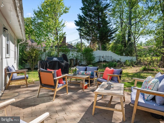 view of patio / terrace featuring an outdoor hangout area and a fenced backyard