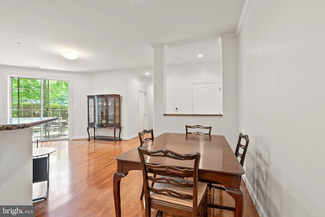 400 Cameron Station Blvd Unit 105, Alexandria, VA 22304 - dining space with light wood-style flooring, crown molding, and baseboards