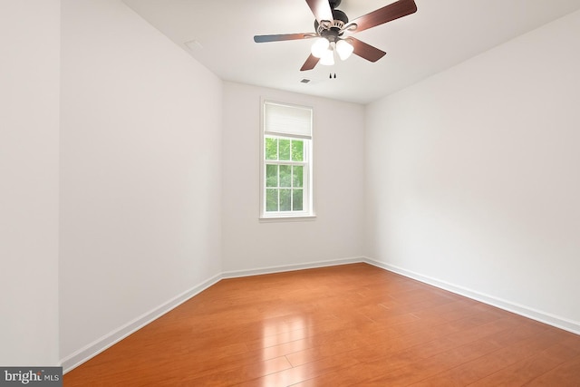 400 Cameron Station Blvd Unit 105, Alexandria, VA 22304 - empty room featuring light wood finished floors, a ceiling fan, and baseboards