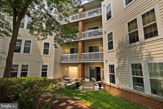 400 Cameron Station Blvd Unit 105, Alexandria, VA 22304 - back of house featuring brick siding and a patio