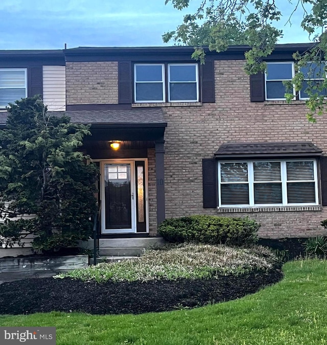 view of front of house featuring brick siding