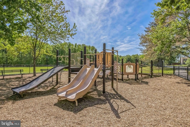 communal playground featuring fence