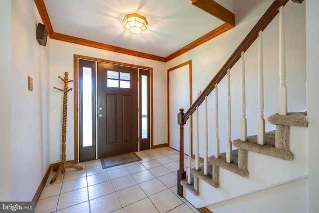 entrance foyer with baseboards, stairs, and light tile patterned flooring