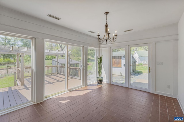 unfurnished sunroom with a chandelier