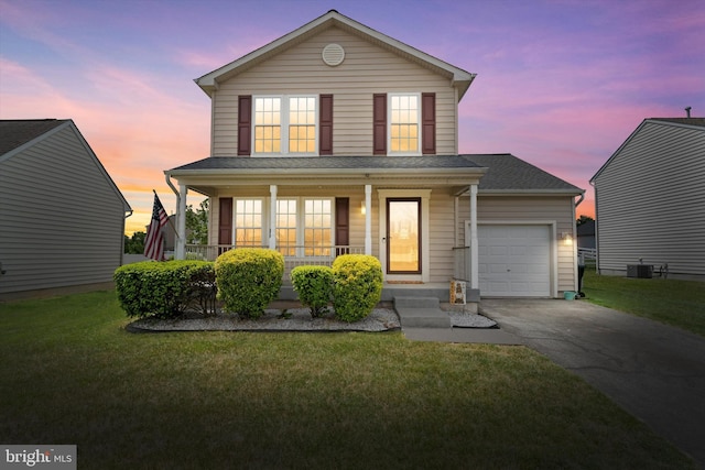 11 Gooseneck Ln, Smyrna, DE 19977 - traditional-style home featuring covered porch, asphalt driveway, central air condition unit, a garage, and a front lawn
