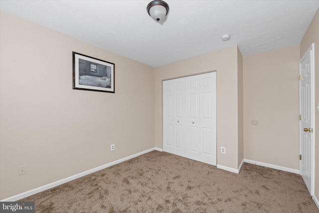 11 Gooseneck Ln, Smyrna, DE 19977 - unfurnished bedroom featuring carpet, a closet, and baseboards