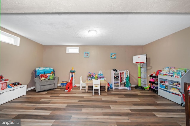 11 Gooseneck Ln, Smyrna, DE 19977 - rec room with plenty of natural light, wood finished floors, and baseboards