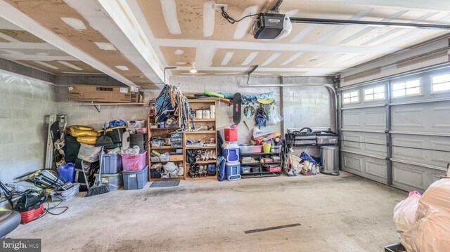 17 Bayside Dr, Somers Point, NJ 08244 - garage with concrete block wall and a garage door opener