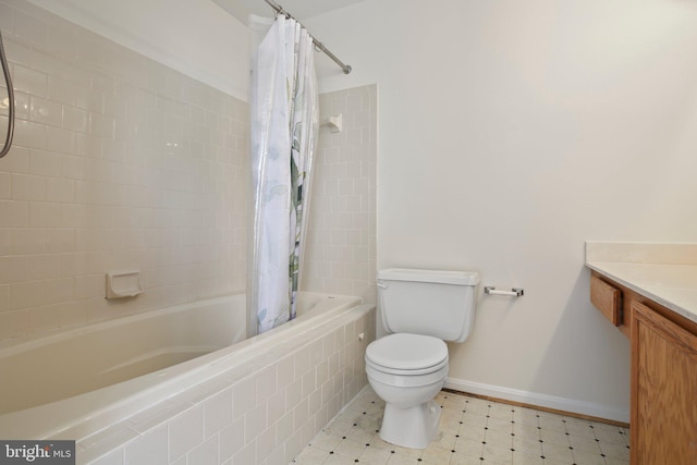full bathroom with vanity, toilet, tile patterned floors, baseboards, and tiled shower / bath combo