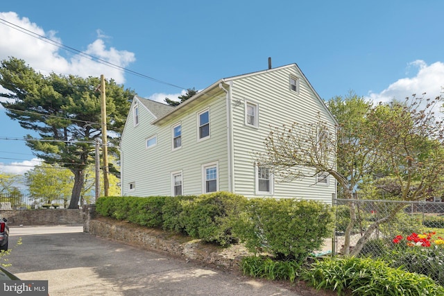 view of property exterior with fence