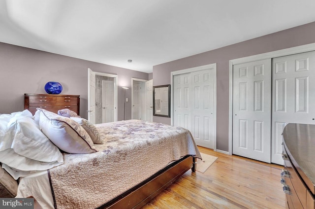 20 Wolfpack Rd, Hamilton, NJ 08619 - bedroom with two closets, baseboards, and light wood-type flooring