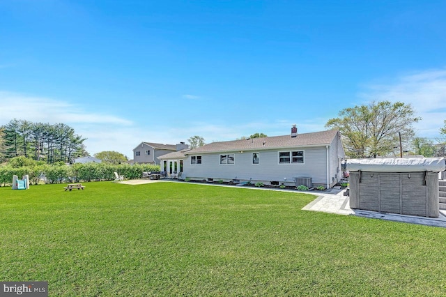 20 Wolfpack Rd, Hamilton, NJ 08619 - back of house with a lawn, a patio, central AC unit, and a chimney