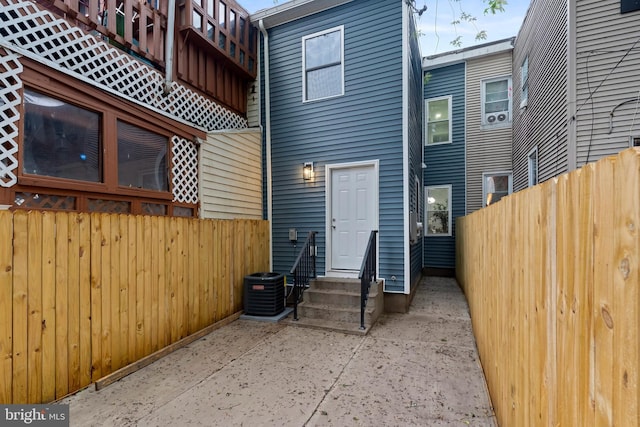 538 Pontiac, Baltimore, MD 21225 - rear view of house with entry steps, fence, and central air condition unit