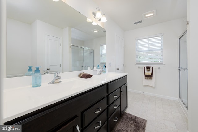 50 Wexford Ct, Morgantown, PA 19543 - bathroom featuring a sink, double vanity, visible vents, and a shower stall