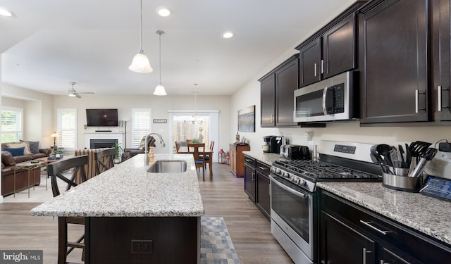 50 Wexford Ct, Morgantown, PA 19543 - kitchen featuring a kitchen breakfast bar, a sink, appliances with stainless steel finishes, open floor plan, and recessed lighting