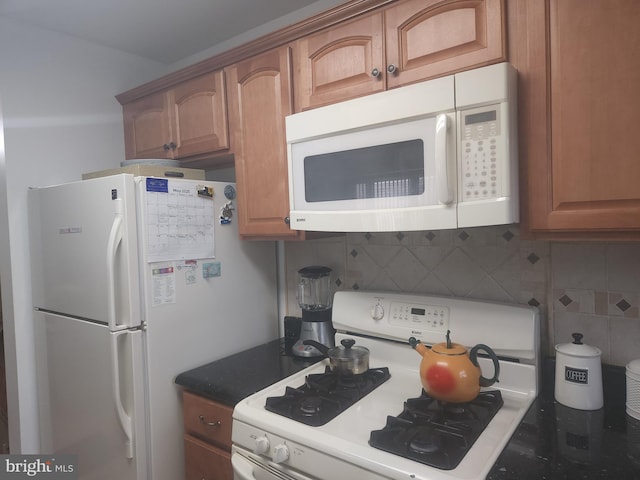 1512 Marcy Pl Unit B, Philadelphia, PA 19115 - kitchen with white appliances, decorative backsplash, brown cabinets, and dark countertops