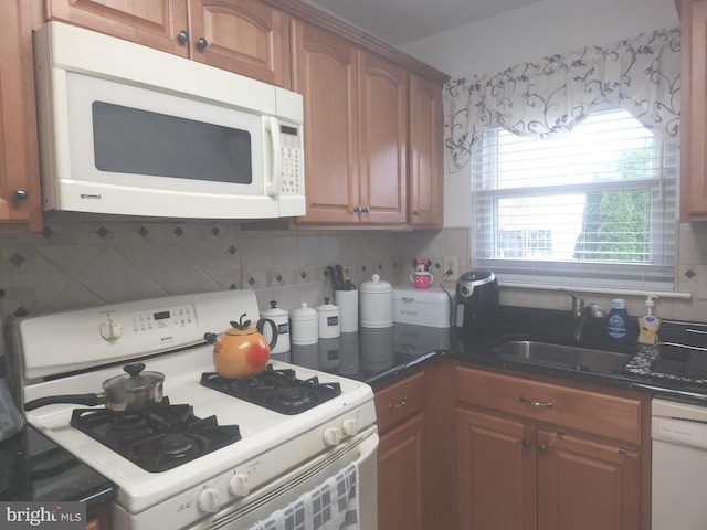 1512 Marcy Pl Unit B, Philadelphia, PA 19115 - kitchen with white appliances, decorative backsplash, and brown cabinetry